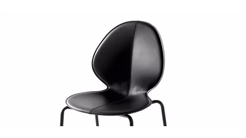 Scaun piele Basil cu sezut inspirat de forma unei frunze de busuioc, piele regenerata si cadru metalic modern.