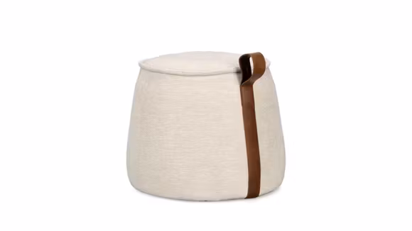 Taburet Anila Light Natural, tapitat cu material tip chenille, umplutura densa pentru confort si maner decorativ din piele ecologica. Design modern si elegant.